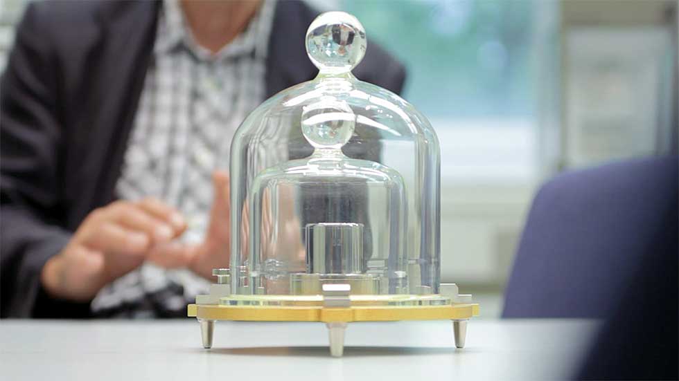 Michael Glaesser at the Physikalisch-Technische Bundesanstalt with Kilogram 52. In June 22, 1799 the meter and the kilogram were realized as physical objects; today these are kept secure at the International Bureau of Weights and Measures, located in a Paris subrurb. 